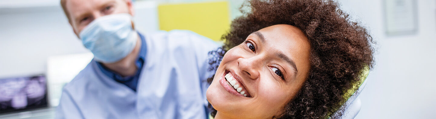 smiling woman who is at a dental appointment