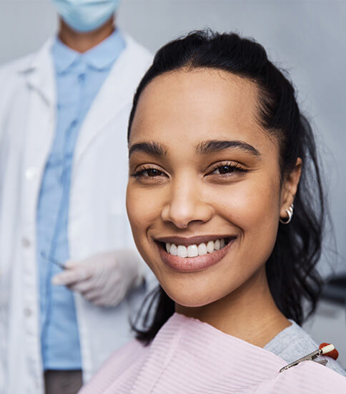 smiling woman sitting in a dental chair