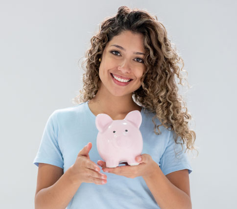 smiling woman with piggy bank